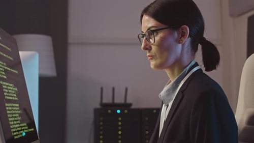 Female Hacker Working at Night Office