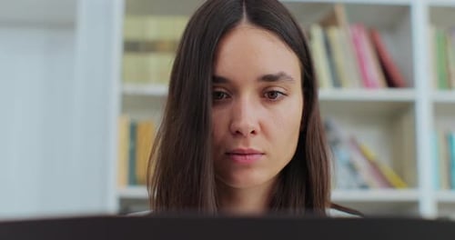 Close Up Portrait Beautiful Girl in Reading Book and Typing on Computer