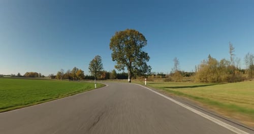 POV view of fall landscape from car