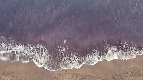 Top View Over Sand Beach and Waves of Blue Sea or Ocean Running on the Shore