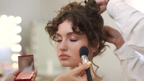 Young Woman Getting Blush Applied in Makeup Room