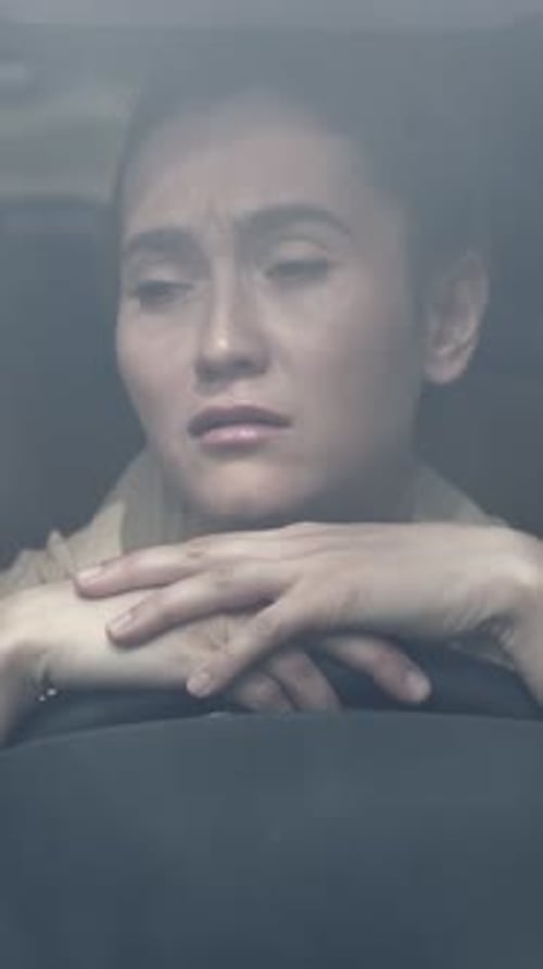 Tired Driver Woman Resting Head On Wheel Foggy Windshield Hands Folded Over Steering Eyes Closed