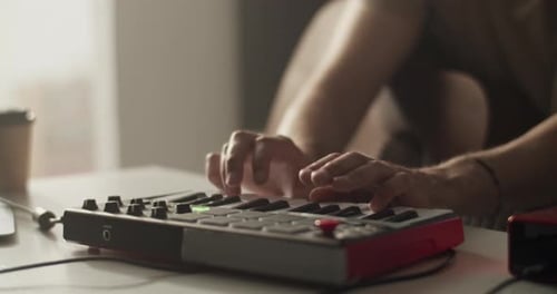 Hands Play Keyboard in Indoor Studio Setting