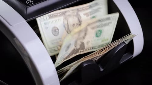 Money Counter Counts American Twenty Dollar Bills