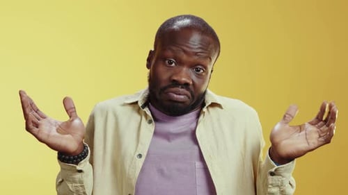 A Humorous Video of a Bearded Man in a Purple Shirt on Yellow