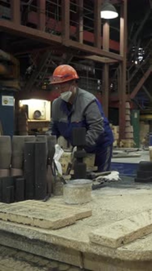 Foundry Workers Preparing Molds for Metal Casting Stock Clip