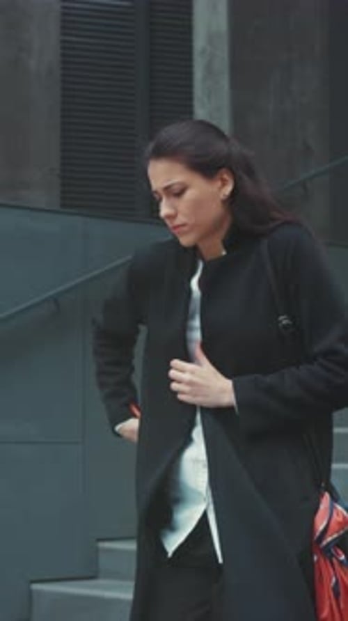 Woman in Distress City Woman Experiencing Sudden Ailment Lady on Stairs Showing Severe Health