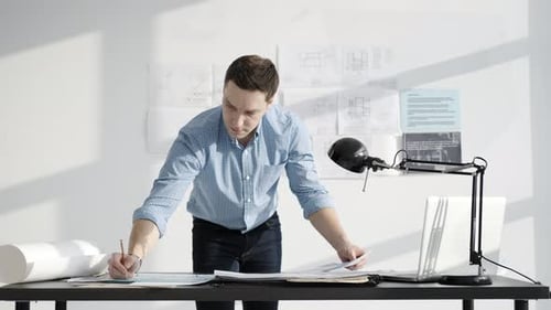 Male Designer 30 Years Old Working with Project in Minimalist Studio