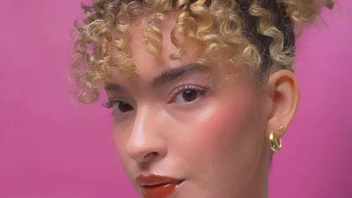 Beauty model close up against pink background