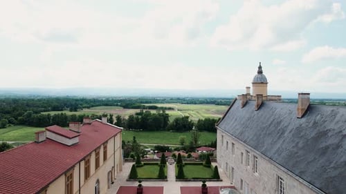 backward drone shot revealing the chateau de Boutheon in Andrezieux Boutheon, Loire Forez, Loire dep