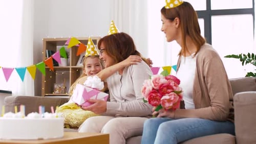 Celebrating Birthday with Flowers and Gift at Home