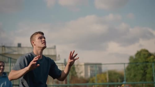 Young Adult Plays Volleyball Outdoors