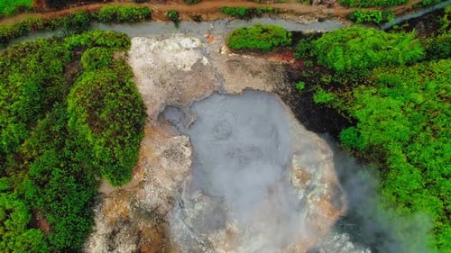 Boiling lava on the edge of the lake