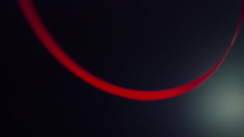 Abstract Red and White Ribbons Floating on Black Background