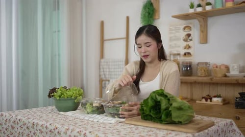 Woman Preparing Healthy Salad in Kitchen