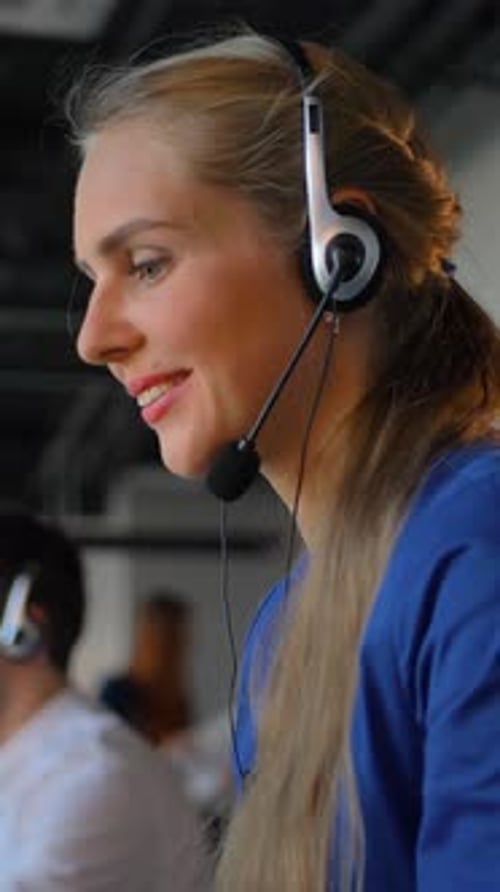 Customer Service Agent at Work in Busy Office