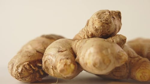 Close-up shot of a rotating brown ginger. 4K.
