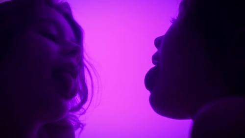 Reflection of a Face in a Mirror on a Purple Background