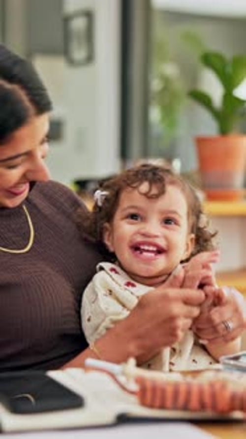Mother, child and clapping hands for success in family home for playful fun