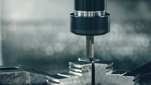 Cnc machining metal workpiece with precision in industrial environment