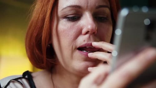 Extreme Close Up of Woman Hands Texting Sending Sms on Smartphone at Cafe and Showing Emotions From