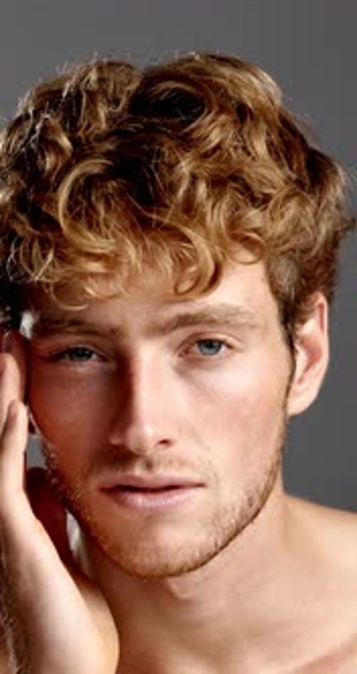 Beauty, face and smile of man in studio for hygiene, masculine grooming or skincare wellness