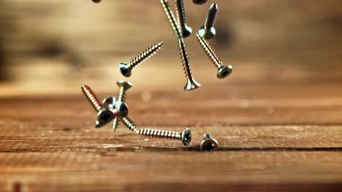 Super Slow Motion Selftapping Screws Fall on the Table