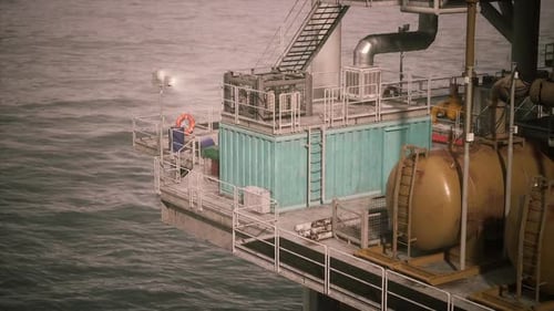 Oil Rig Structure with Equipment Overlooking Calm Ocean Surface During Daylight