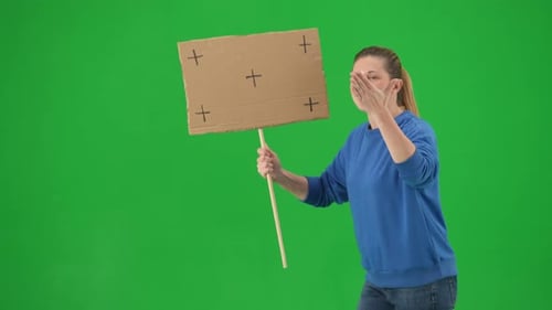 Female Activist Walking on Green Screen Shouting Protest Slogans Close Up Woman Holding an Empty
