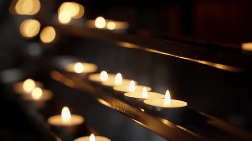 Close-up shot of burning candle over the wood. composition of many candles