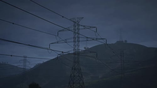 The High Voltage Electricity Tower And The Thunder On Night Dark Sky