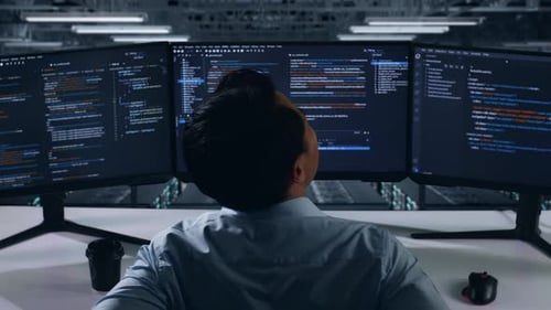 Back View Of Asian Man Developer Having Backache While Write Code In Data Center