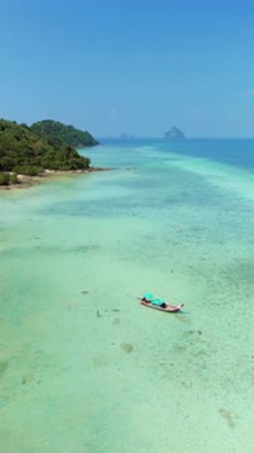 Aerial View of a Tropical Beach with Boat on the Water Koh Kradan Thailand