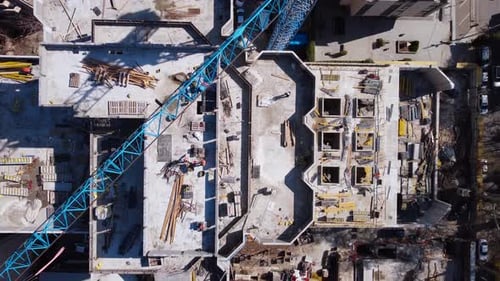 Construction Site Aerial View with Blue Crane
