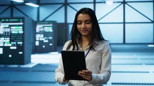 Admin in Data Center Monitoring Security Threats with Tablet