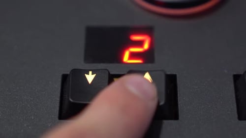 CloseUp Finger Changing Preset with Arrow Buttons on Lighting Mixer