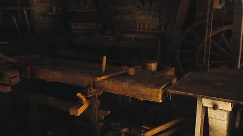 Old Wooden Workshop with Tools and Rustic Furniture in a Quiet Setting