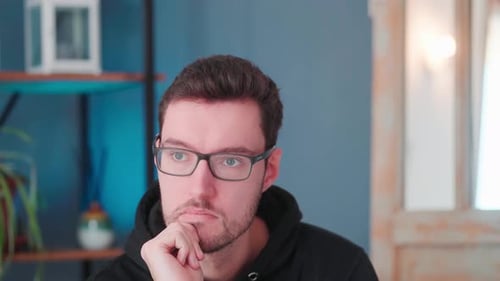 Young man thinking, hand on chin, thinking pose. expression emotions deep thoughts pondering over pr
