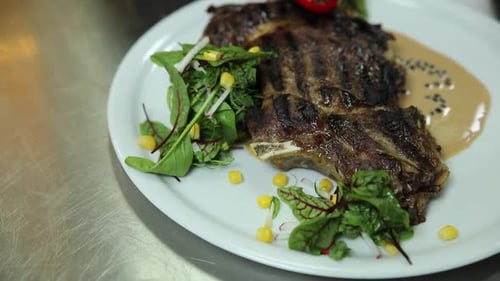 the chef prepares delicious meat in the restaurant