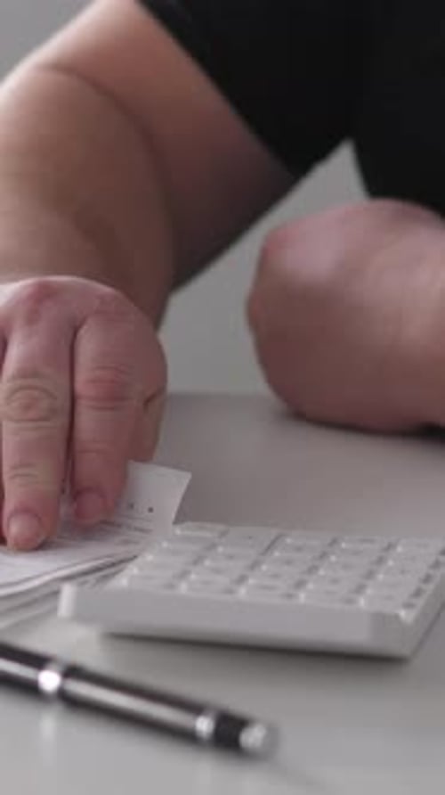 Financial Review With Calculator Hands Analyzing Receipts At Work Station Serene Financial
