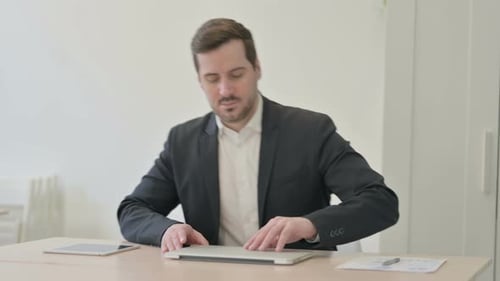 Businessman Coming Back to Office for Work