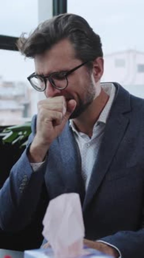 A Dedicated and Focused Businessman is Working Diligently in a Modern Office Setting