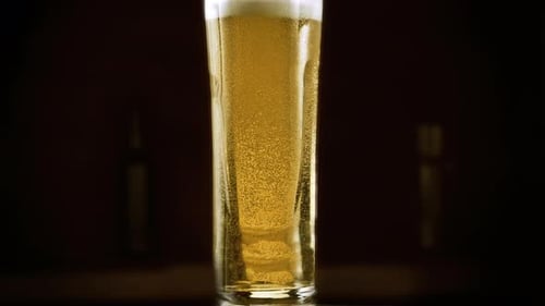 Beer in Glass with Rising Bubbles Close Up