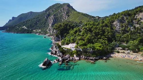 Aerial View of Scenic Coastline with Clear Turquoise Waters and Lush Trees