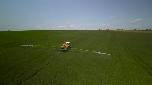 Spray Fertilize On Field With Chemicals In Agriculture Field