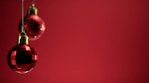 Red Christmas Ornaments on Red Background