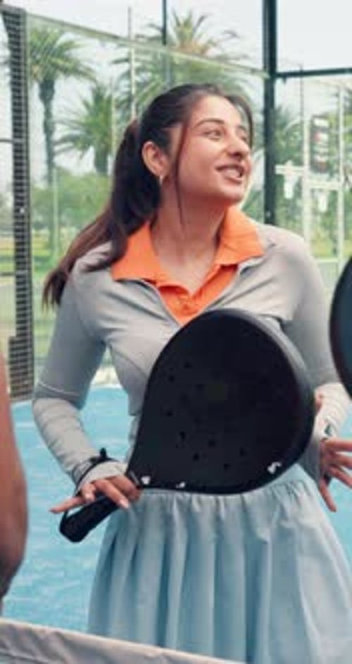 Girl, talk and laugh at tennis court for padel, game and start with training routine for fitness