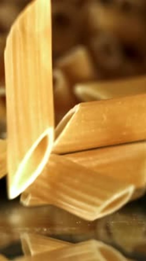 Super Slow Motion Dry Penne Pasta Filmed on a Highspeed Camera at 1000 Fps