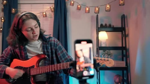 Close Up Footage of Art Woman Bloggers Online Lesson Recording Playing Guitar