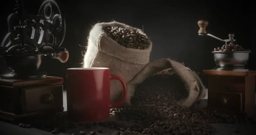 Still life with antique coffee grinders and beans